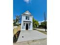 Striking two-story home with a gabled roof and a concrete driveway, set against a clear blue sky at 1956 Beech Ave, North Charleston, SC 29405