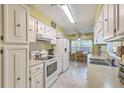 Bright kitchen with white cabinetry and a breakfast nook at 201 Hunt Club Dr, Summerville, SC 29485