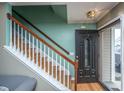 Inviting entryway with hardwood floors, staircase, and stylish front door at 3033 Kinswood Ln, Ladson, SC 29456