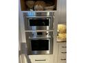 Close up of updated built in microwave and oven in a modern kitchen at 330 Concord St # 15C, Charleston, SC 29401