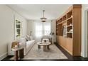 Bright living room with custom shelving, modern lighting, and comfortable seating area at 40 Dunnemann Ave, Charleston, SC 29403
