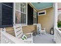 Inviting front porch with rocking chairs at 44 Savage St, Charleston, SC 29401
