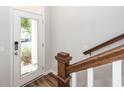 Bright entryway featuring wood flooring, staircase and sidelight windows by the front door at 4577 Summey St, North Charleston, SC 29405