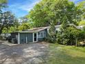 The rear exterior reveals a home design with an exterior door with a small covered porch at 4869 Slans Island Rd, Hollywood, SC 29449