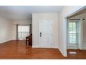 Inviting home foyer with hardwood floors and a view into the living and dining areas at 5496 Clearview Dr, North Charleston, SC 29420