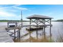 Well constructed boat dock with a boat lift and easy access to the water at 5703 St Angela Dr, North Charleston, SC 29418