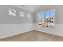 Inviting living room with decorative moldings, large windows and wood-look flooring at 701 Maynard Ln, Summerville, SC 29486