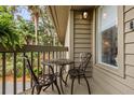 Cozy balcony featuring a small table and two chairs, perfect for enjoying the outdoor scenery at 754 Summerwind Cir, Edisto Island, SC 29438
