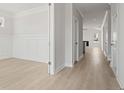 Bright hallway featuring luxury vinyl plank floors and leading to an open-concept living space at 757 Maynard Ln, Summerville, SC 29486