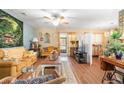 Bright living room with ceiling fan and sliding doors offering natural light at 7873 Park Gate Dr, North Charleston, SC 29418