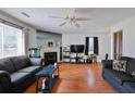 Inviting living room featuring a fireplace, hardwood floors, and lots of natural light at 7921 Cricket Ct # D, North Charleston, SC 29418