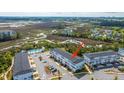 An aerial view of the townhome community with beautiful marsh views and an in-ground pool at 806 Kings Oak Court Ct # 7, Charleston, SC 29492