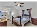 Comfortable bedroom with vaulted ceiling, ceiling fan, and a full ensuite bathroom at 8219 Quail Hollow Ct, North Charleston, SC 29420