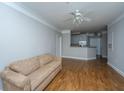 Bright, open-concept living space featuring hardwood floors and modern finishes, next to kitchen at 1025 Riverland Woods Pl # 901, Charleston, SC 29412