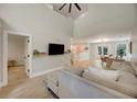 Comfortable living room features a large sectional sofa, modern decor, and a seamless flow to the dining area at 1027 Island View Ct, Charleston, SC 29492