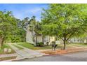 Home exterior showing a driveway and well-maintained landscaping at 108 Gaslight Blvd, Summerville, SC 29483