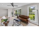 Cozy living room with bay window, modern furniture, and a stylish ceiling fan at 111 Driver Ave, Summerville, SC 29483