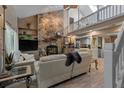 Inviting living room showcasing a stone fireplace, vaulted ceiling, and an open layout at 111 Garden Hill Rd, Summerville, SC 29483