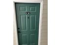Stylish, green front door with unit number and classic knocker at 1300 Park West Blvd # 516, Mount Pleasant, SC 29466