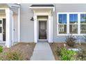 Attractive front door with modern hardware and a welcoming entryway at 131 Brown Swiss Cir, Summerville, SC 29483