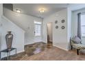 Bright foyer featuring a staircase, tile and carpet flooring, and neutral decor at 134 Stoney Creek Way, Moncks Corner, SC 29461