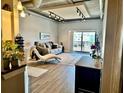 Inviting living room featuring a plush sofa, floor-to-ceiling sliding doors, and concrete ceiling at 150 Bee St # 611, Charleston, SC 29401
