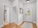 Bright entryway features hardwood floors, white walls, and a front door with a decorative window at 1513 Thin Pine Dr, Johns Island, SC 29455