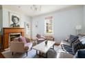 Cozy living room featuring a fireplace, comfortable seating, and ample natural light at 162 Spring St # A, Charleston, SC 29403