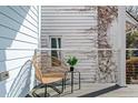Cozy porch area with a wicker chair and small table, ideal for quiet moments at 162 Spring St # D, Charleston, SC 29403