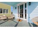 Inviting front porch featuring comfortable seating, perfect for relaxing and enjoying the outdoors at 162 Spring St # D, Charleston, SC 29403