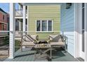 Relaxing porch setup with cozy chairs and a table, creating a comfortable outdoor space at 162 Spring St # D, Charleston, SC 29403