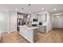 Modern kitchen boasts stainless steel appliances, granite countertops, and ample cabinet space at 2308 Watchtower Ln, Charleston, SC 29414