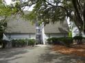 Rear exterior of the condo building, showcasing the parking area at 237 Driftwood Ln, Edisto Island, SC 29438