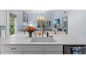 Modern kitchen with an island, quartz countertops, and stylish pendant lighting at 2401 Racquet Club Dr, Seabrook Island, SC 29455