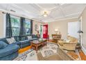 Inviting living room featuring a comfortable sofa, decorative rug, and ample natural light, perfect for relaxation and entertaining at 32 Rosedale Dr, Charleston, SC 29407