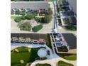 Aerial view of community highlighting lush landscaping and colorful townhomes at 330 Concord St # 15B, Charleston, SC 29401