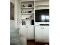 Custom built-in shelving and cabinets offer stylish storage for your home entertainment at 330 Concord St # 6C, Charleston, SC 29401