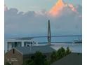 Distant view of the impressive Ravenel Bridge from property, with white clouds at 330 Concord St # 6C, Charleston, SC 29401