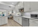 Contemporary kitchen boasting white cabinets, marble countertops, and stainless steel appliances at 3372 Billings St, Mount Pleasant, SC 29466