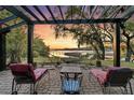 Relaxing outdoor patio featuring comfortable lounge chairs, hammock, and scenic waterfront views at 3610 Legareville Rd, Johns Island, SC 29455