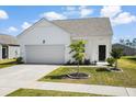 Well-kept single-story home boasting a garage, maintained lawn, and a welcoming front entrance at 412 Pender Woods Dr, Summerville, SC 29486