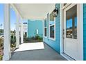 Inviting covered front porch with white columns offering neighborhood views of the street at 816 Gentle Breeze Dr, Summerville, SC 29486