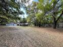 Spacious yard with a two car garage and charming home at 8392 Herbert Smalls Rd, Edisto Island, SC 29438