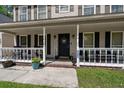 Inviting front porch with a welcoming entrance and charming decor at 8524 Belford Ct, North Charleston, SC 29420