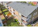 Overhead rear exterior view of townhomes showcasing balconies, patios, well-kept lawns, and fencing at 9226 Southern Oak Ln, Ladson, SC 29456