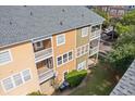 Townhome's rear exterior featuring multiple balconies, well-maintained landscaping, and a shared green space at 9226 Southern Oak Ln, Ladson, SC 29456