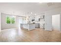 Open concept kitchen featuring stainless steel appliances, a center island, and pendant lighting at 9428 Sweep Dr, Summerville, SC 29485