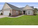 Lovely home with brick accents, a well-maintained lawn, and a welcoming entrance at 1047 Tyron Cir, Charleston, SC 29414