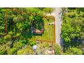 Aerial view of property with boundary line, showcasing the home, yard, and surrounding landscape at 11341 Cottageville Hwy, Cottageville, SC 29435