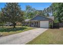 Inviting single Gathering home with an attached garage, and a driveway at 122 William St, Summerville, SC 29486